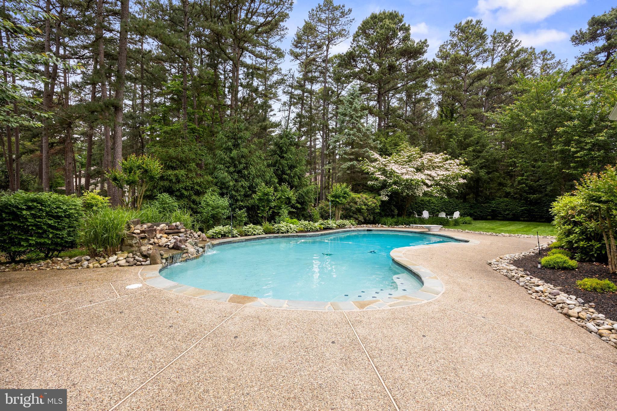 4 False Heather Way Medford, NJ 08055 - Photo 36 of 48 a view of a swimming pool with a yard