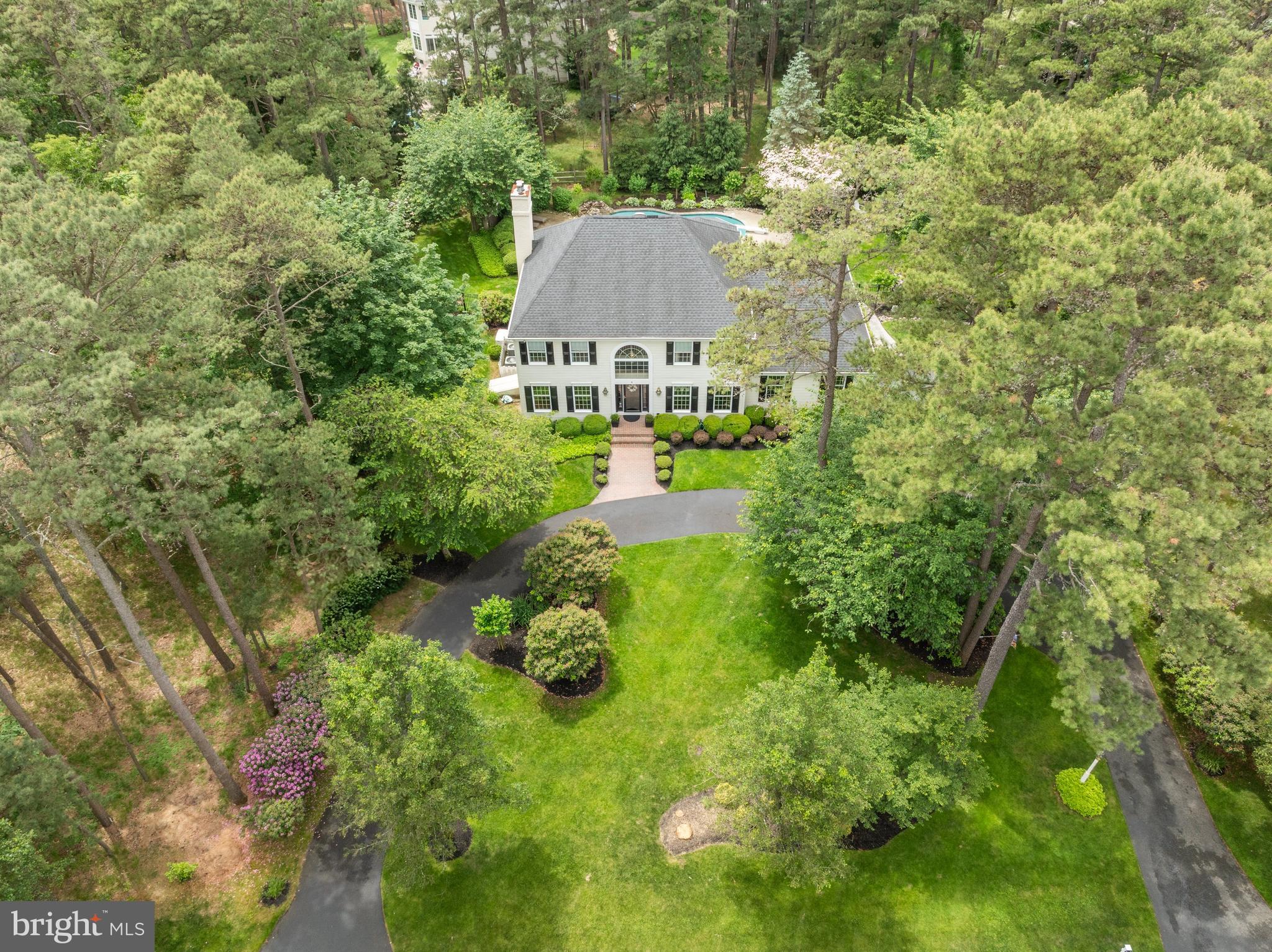 4 False Heather Way Medford, NJ 08055 - Photo 43 of 48 a aerial view of a house with a yard and large trees