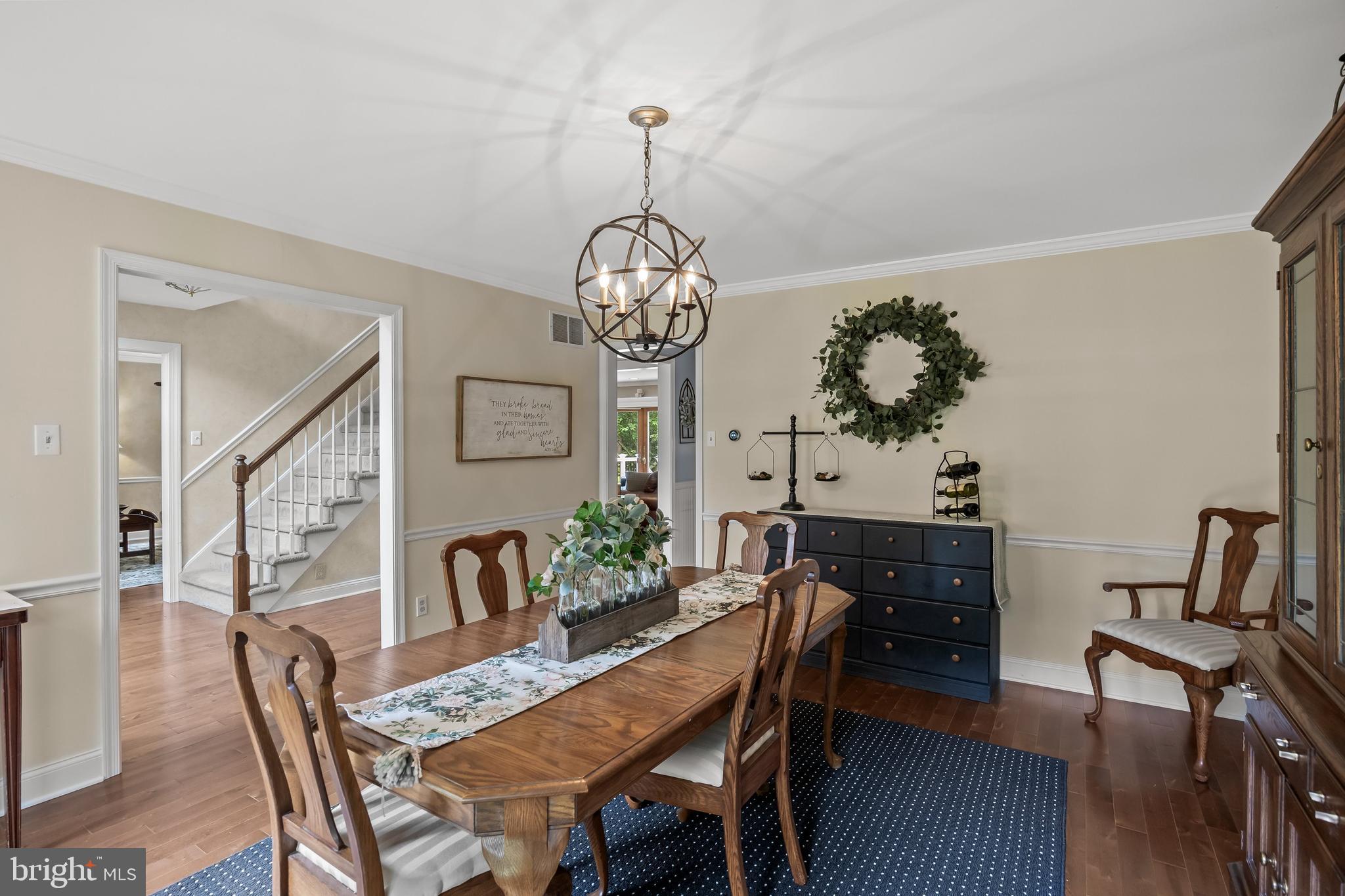 4 False Heather Way Medford, NJ 08055 - Photo 9 of 48 a view of a dining room with furniture wooden floor and a chandelier