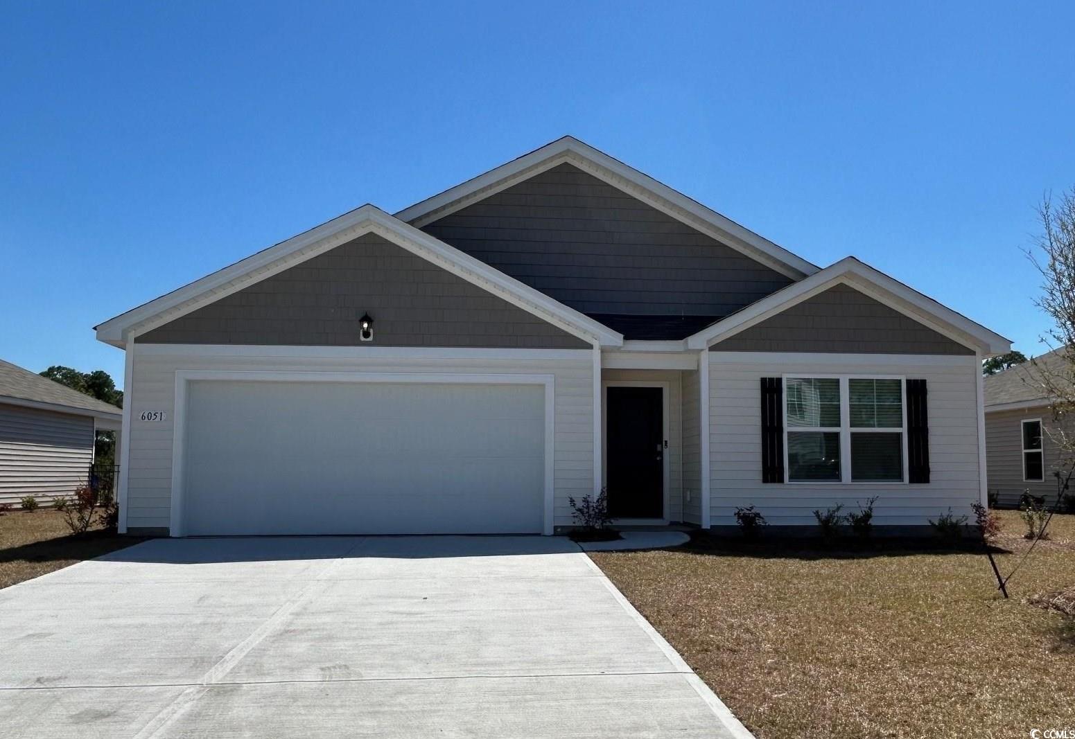 6051 Fuller Rdg Court Conway, SC 29526 - Photo 1 of 23 View of front facade with a garage and concrete dr