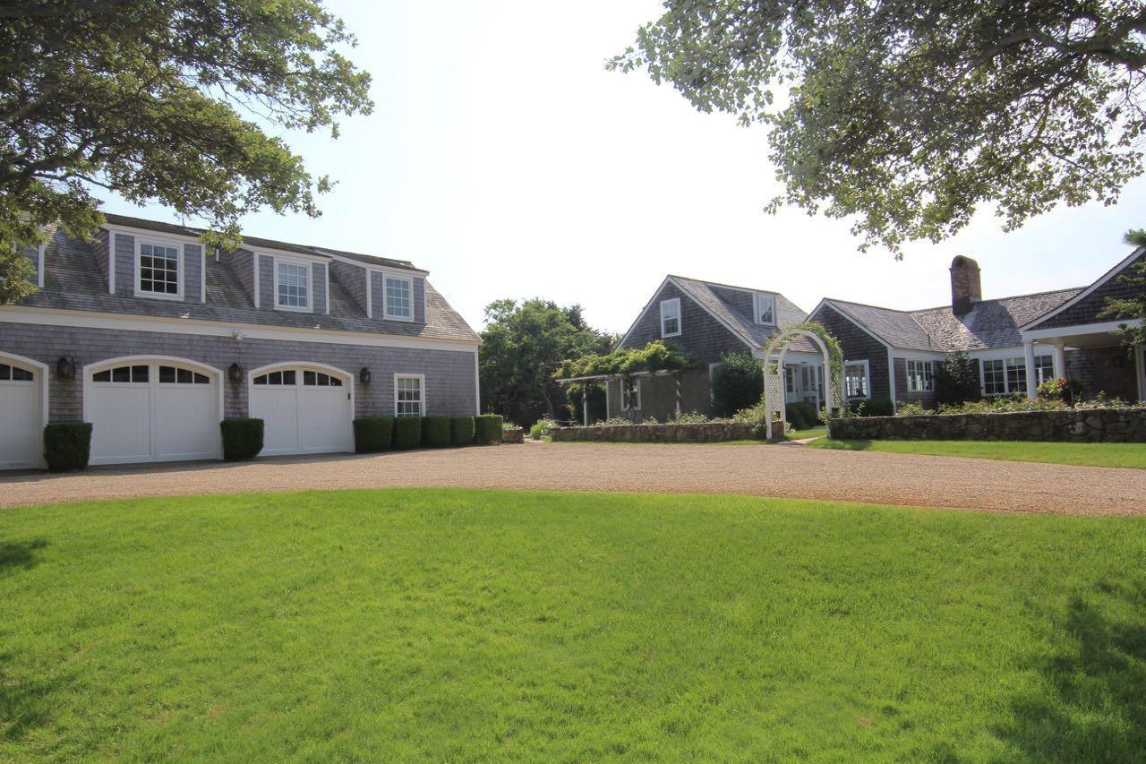 55 North Neck Road Edgartown, MA 02539 - Photo 31 of 35 a front view of house with yard and trees in the background