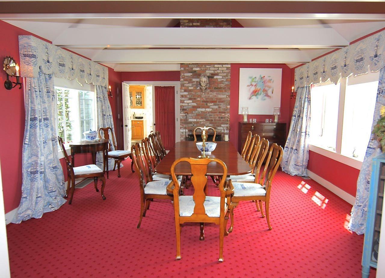 55 North Neck Road Edgartown, MA 02539 - Photo 8 of 35 a dining room with furniture a rug and a large window