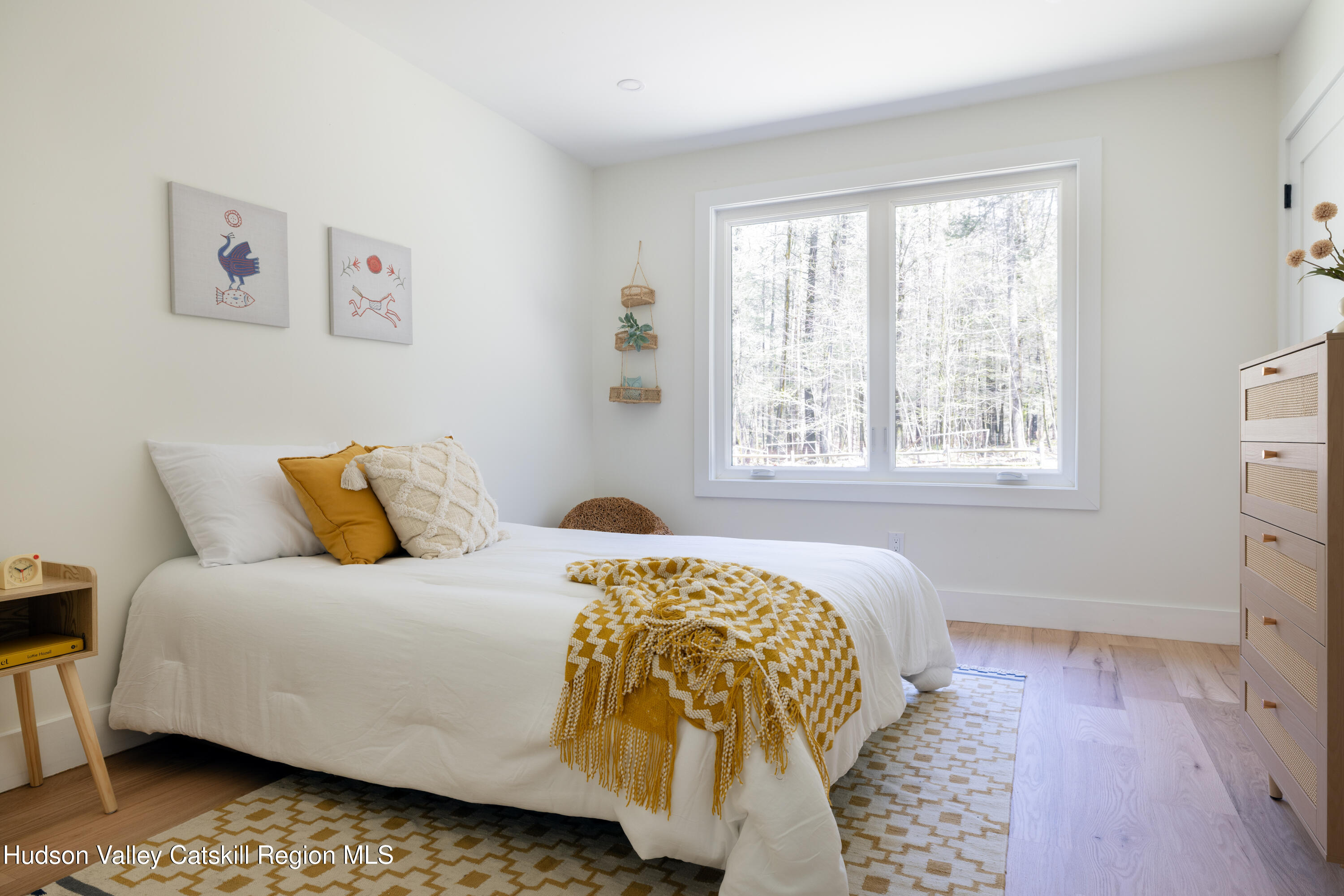 92 Upper Cherrytown Road Kerhonkson, NY 12446 - Photo 22 of 36 a bedroom with a bed and wooden floor