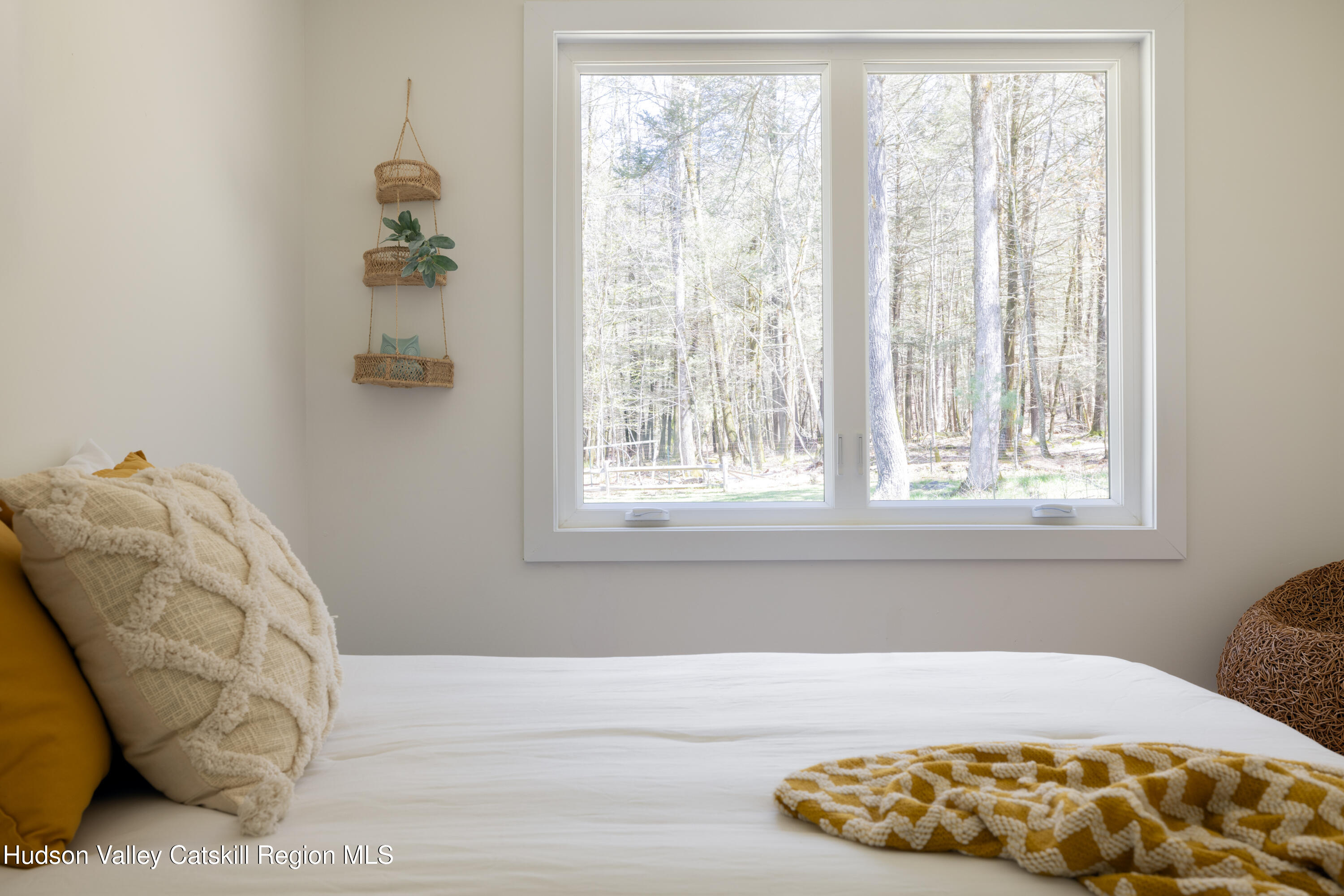 92 Upper Cherrytown Road Kerhonkson, NY 12446 - Photo 23 of 36 a bedroom with a bed and a window
