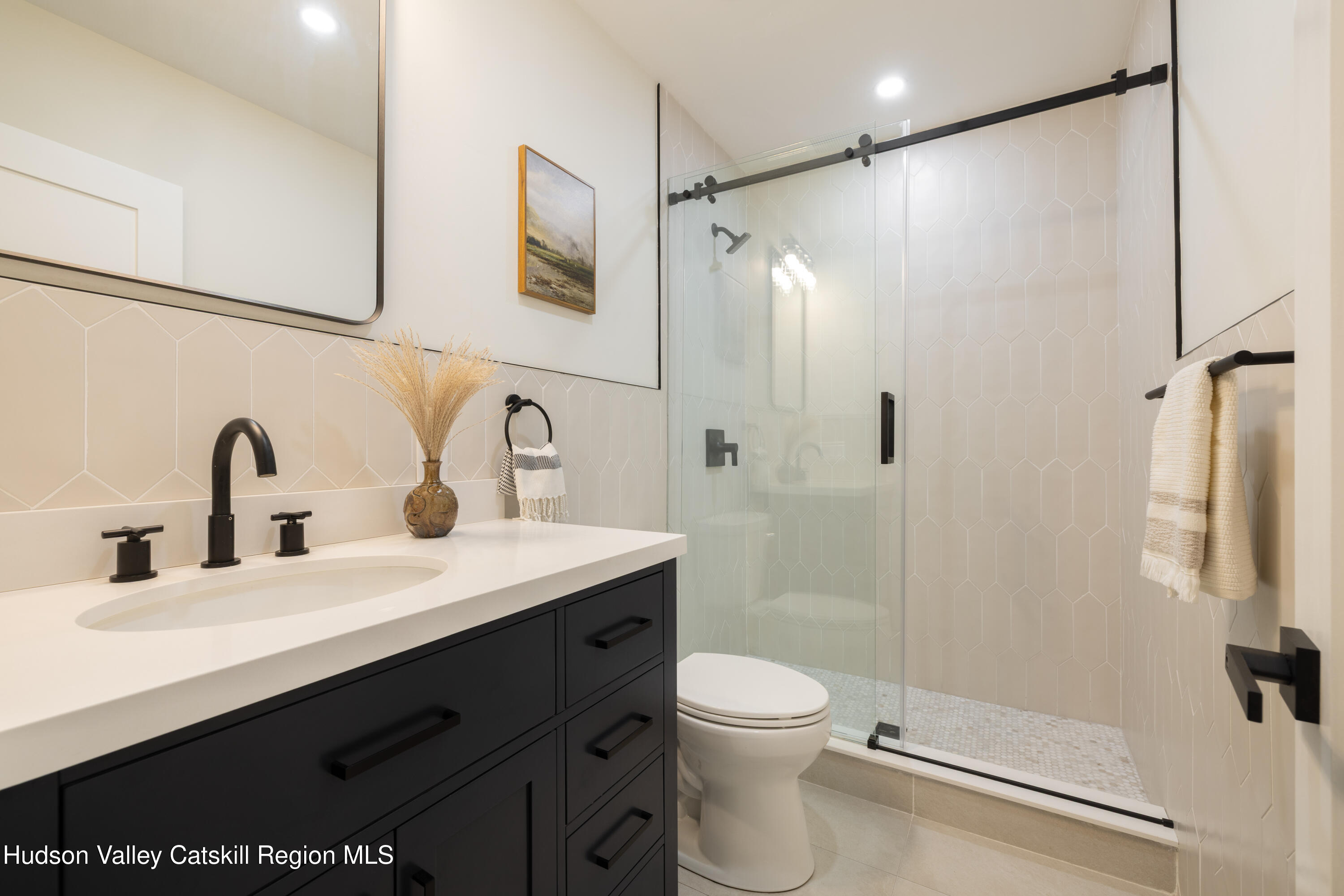 92 Upper Cherrytown Road Kerhonkson, NY 12446 - Photo 24 of 36 a bathroom with a shower sink vanity mirror and toilet