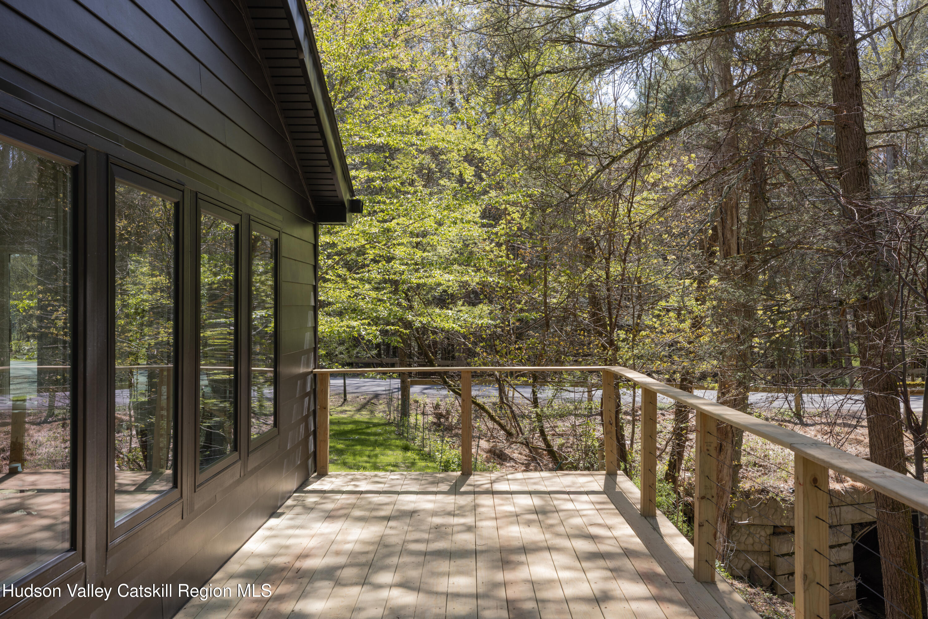 92 Upper Cherrytown Road Kerhonkson, NY 12446 - Photo 28 of 36 a view of balcony with wooden floor and fence