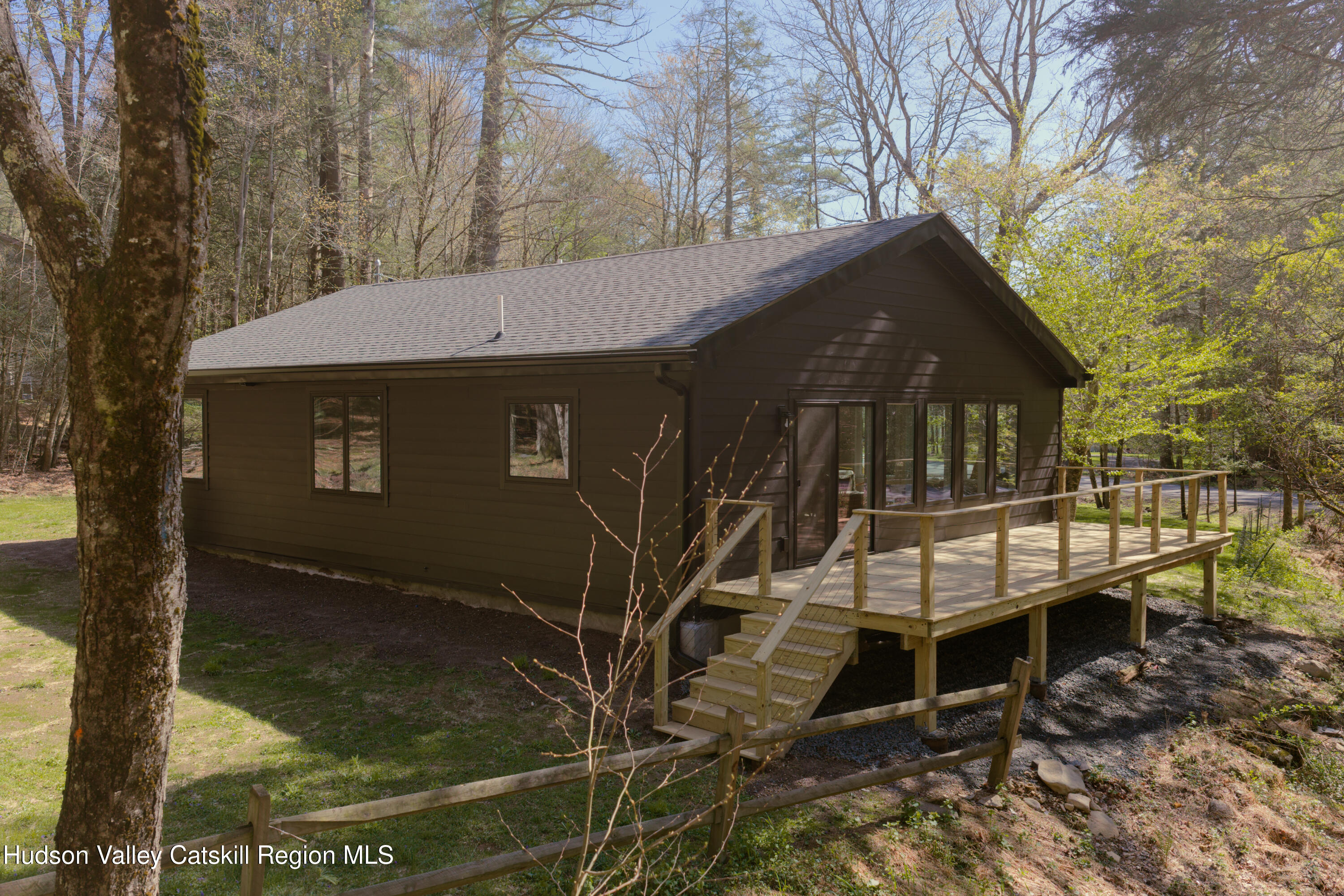 92 Upper Cherrytown Road Kerhonkson, NY 12446 - Photo 30 of 36 a backyard of a house with table and chairs