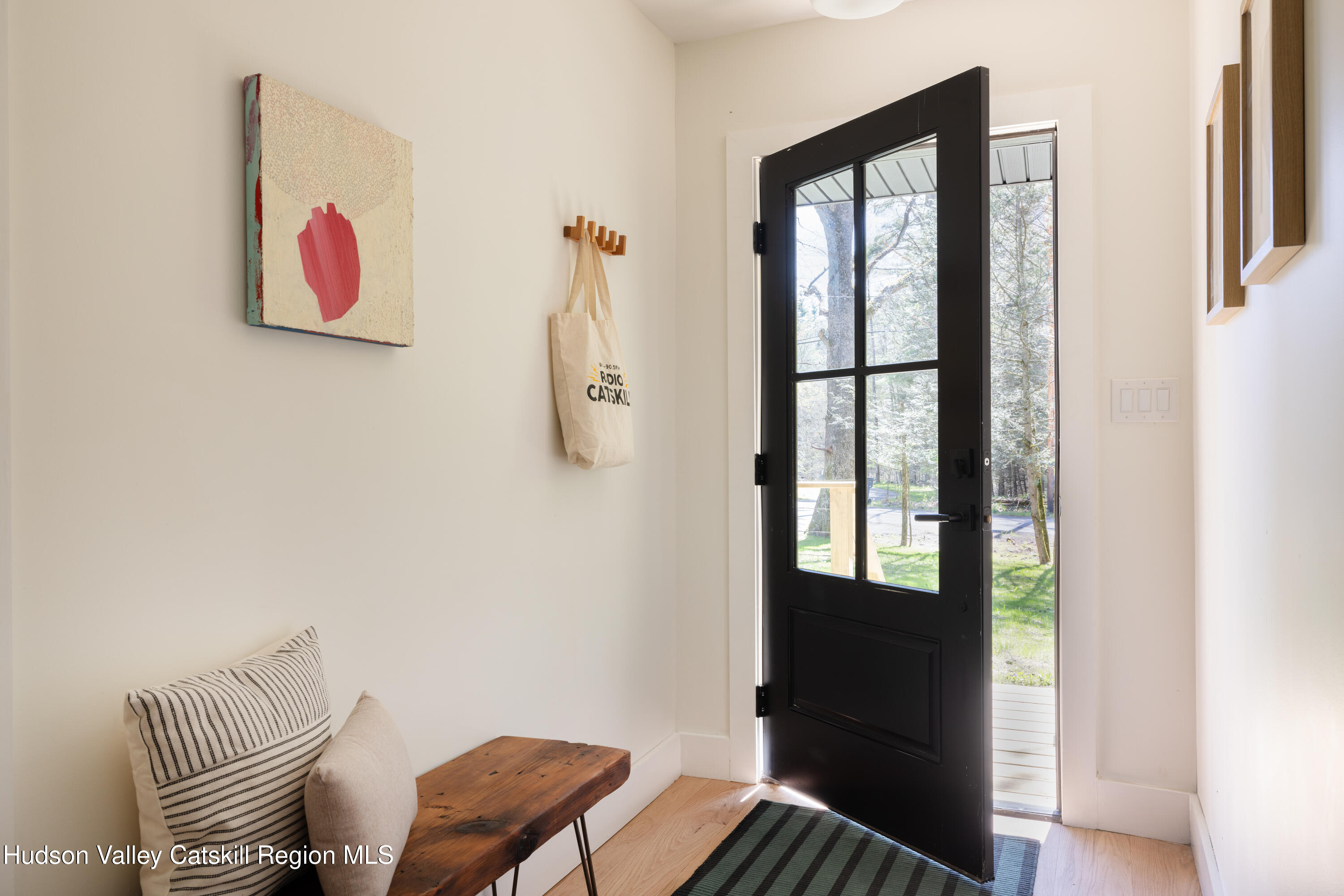 92 Upper Cherrytown Road Kerhonkson, NY 12446 - Photo 10 of 36 a view of a hallway with paintings on the wall