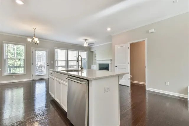 a kitchen with stainless steel appliances granite countertop a stove and a refrigerator