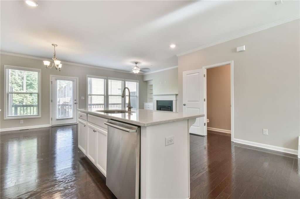354 Provenance Drive Atlanta, GA 30328 - Photo 11 of 30 a kitchen with stainless steel appliances granite countertop a stove and a refrigerator