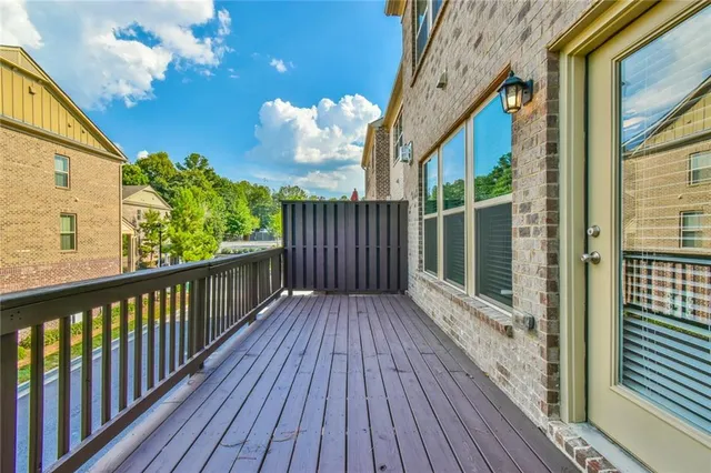 a view of a balcony with wooden floor