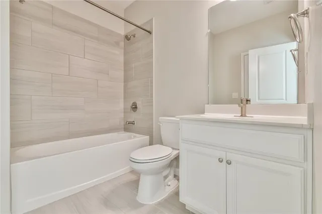 a bathroom with a sink a toilet and a bathtub