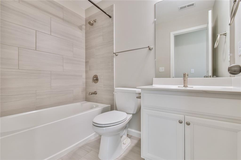 354 Provenance Drive Atlanta, GA 30328 - Photo 21 of 30 a bathroom with a sink toilet and shower