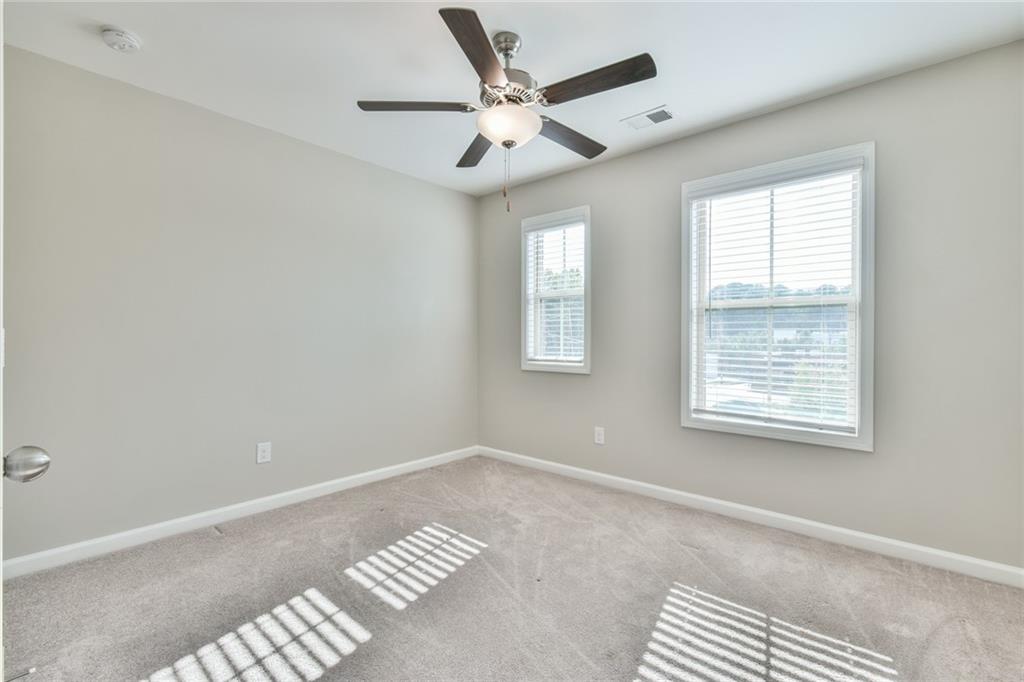 354 Provenance Drive Atlanta, GA 30328 - Photo 22 of 30 a view of an empty room with a window