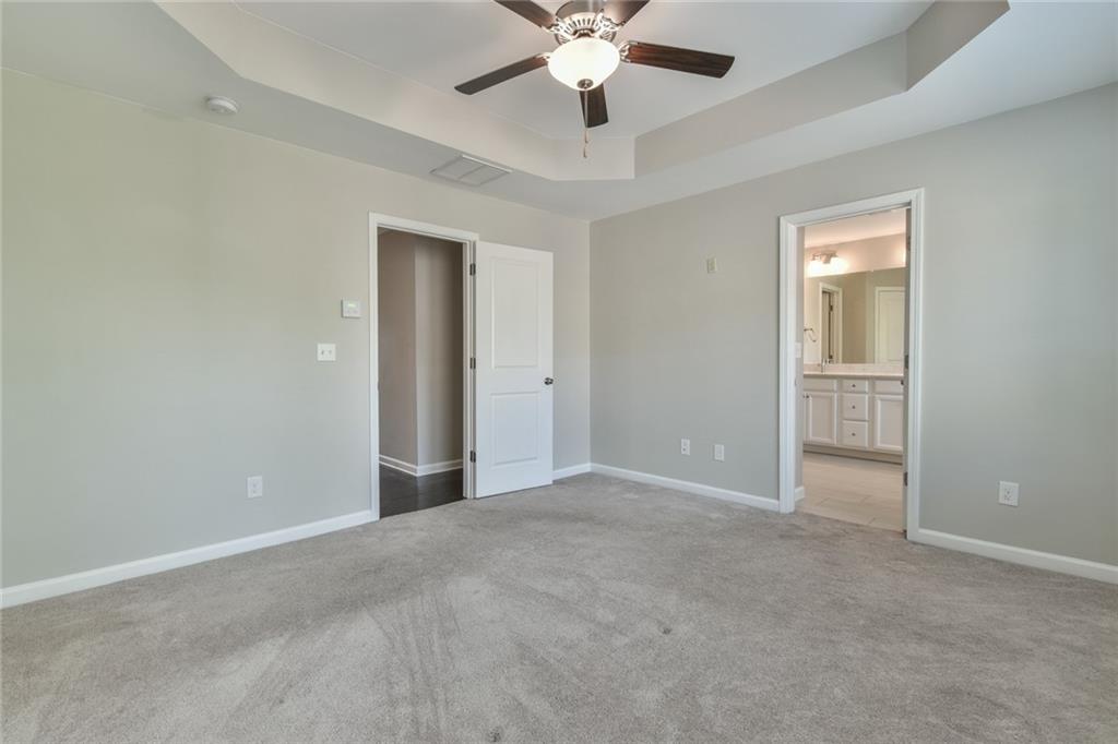 354 Provenance Drive Atlanta, GA 30328 - Photo 25 of 30 an empty room with closet and a ceiling fan