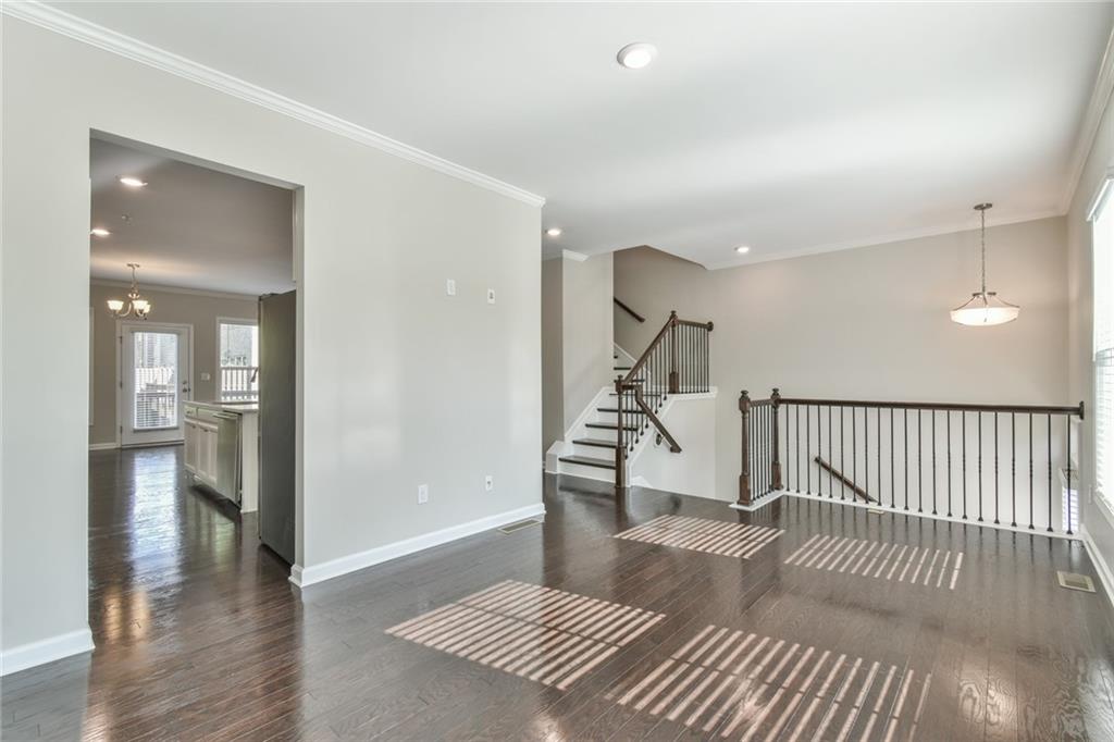 354 Provenance Drive Atlanta, GA 30328 - Photo 4 of 30 a view of a hallway with wooden floor and windows