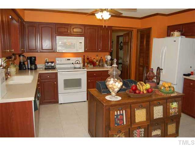 1601 Brook Run Drive Raleigh, NC 27614 - Photo 3 of 12 Big updated kitchen. Newer solid surface counter tops, kitchen floor, built-in microwave,fixtures, brand new dishwasher.
