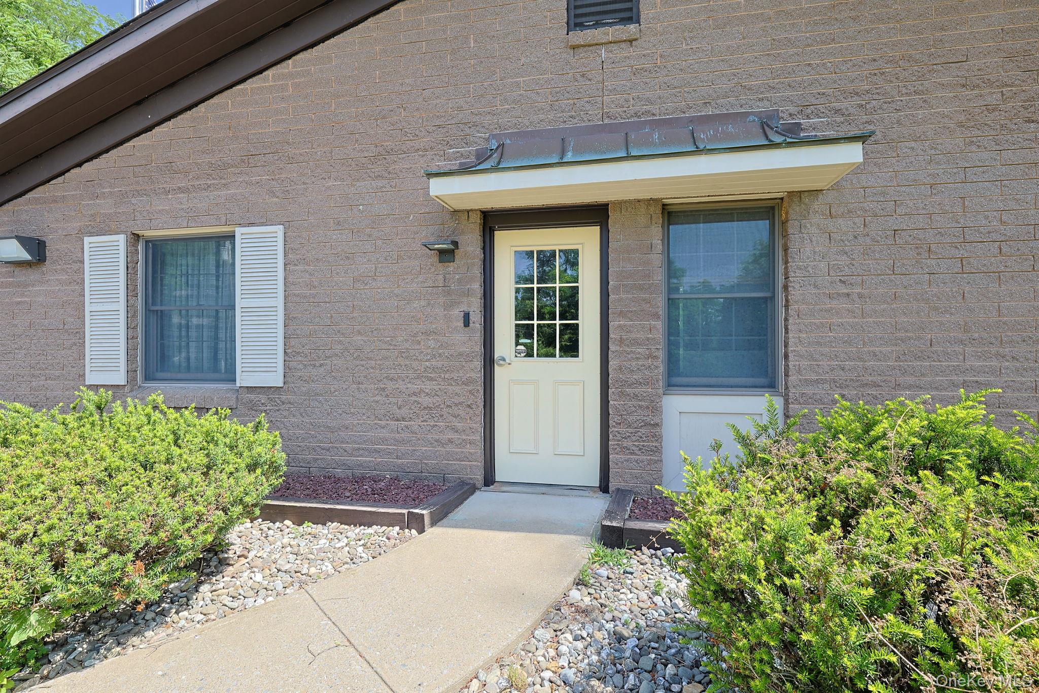 501 Cedar Hill Road Fishkill, NY 12524 - Photo 4 of 19 a front view of a house with garden