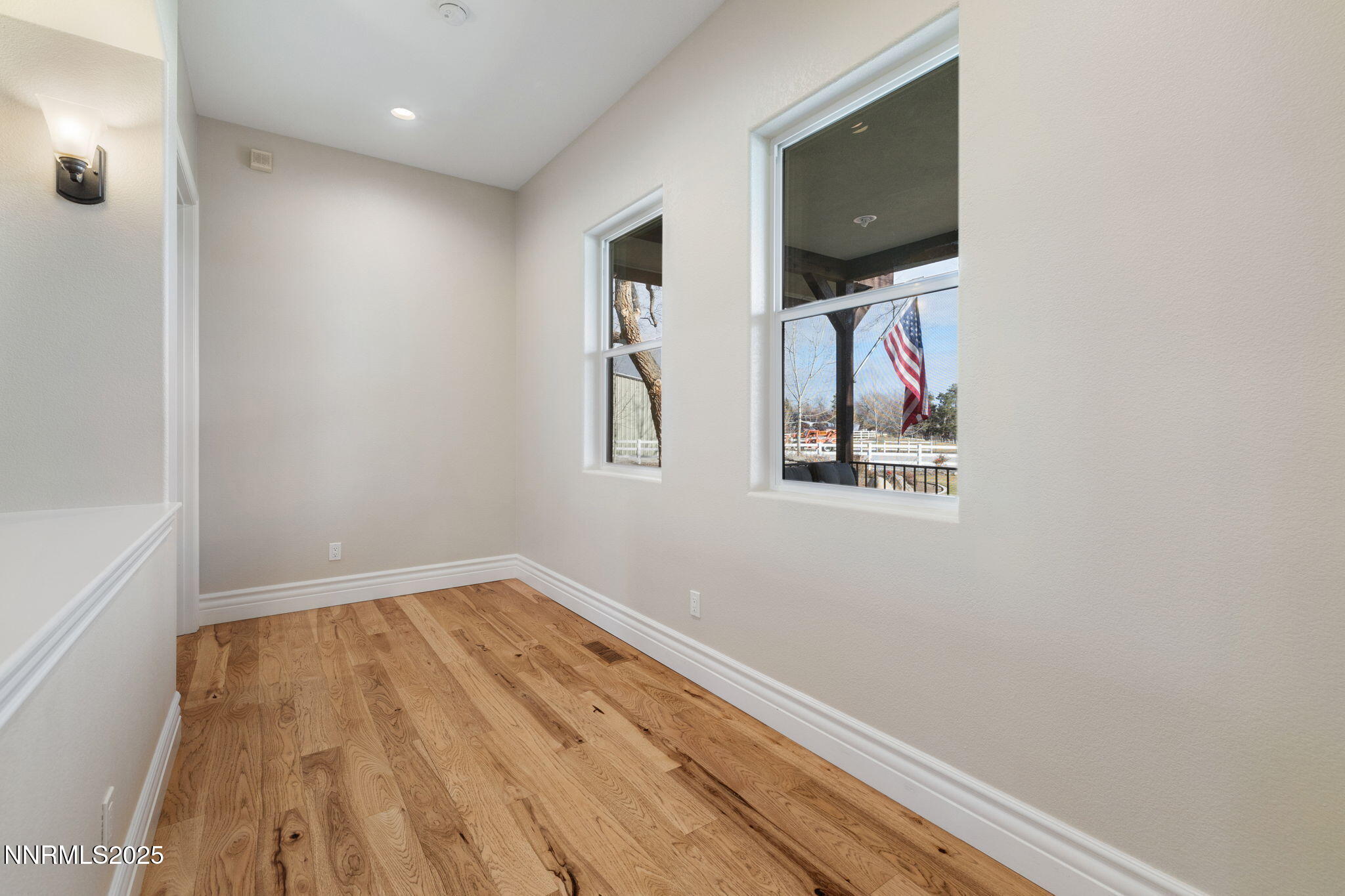 505 Sierra Manor Drive Reno, NV 89511 - Photo 16 of 36 a view of empty room with wooden floor and fan