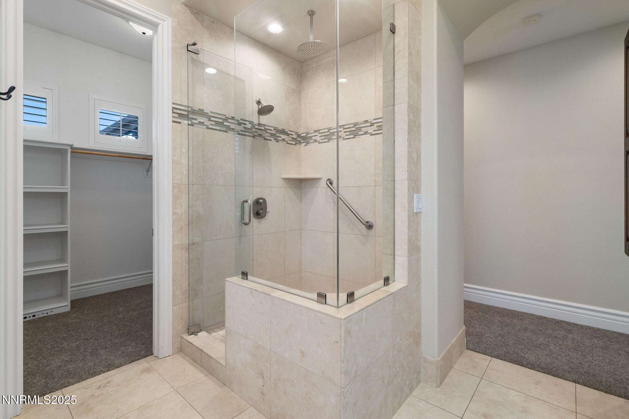 505 Sierra Manor Drive Reno, NV 89511 - Photo 18 of 36 a bathroom with a glass shower door