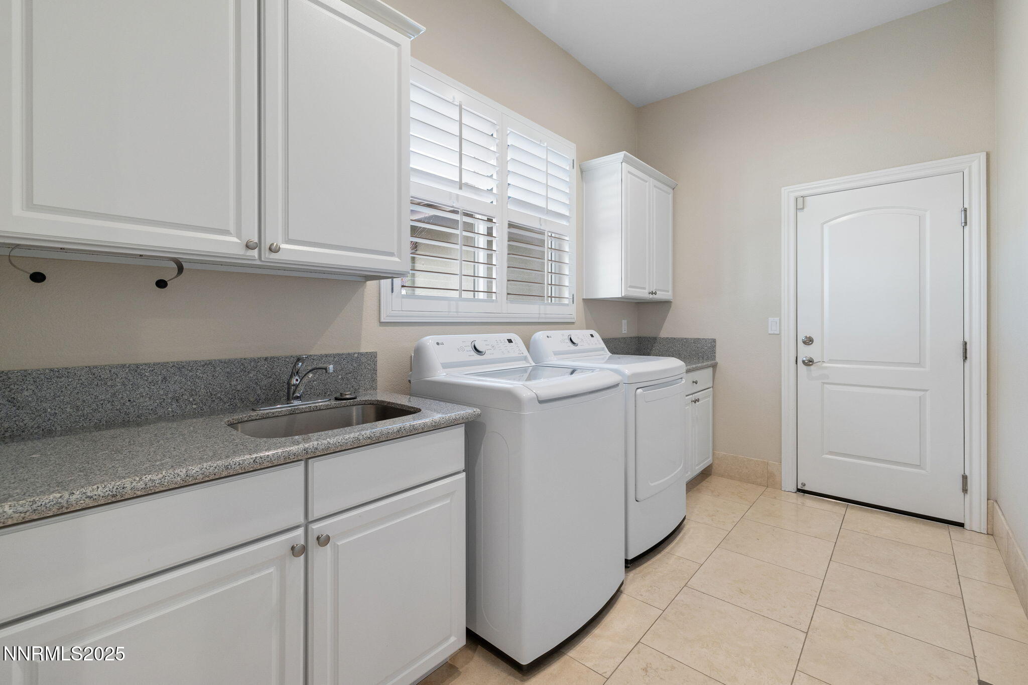 505 Sierra Manor Drive Reno, NV 89511 - Photo 23 of 36 a utility room with cabinets washer and dryer