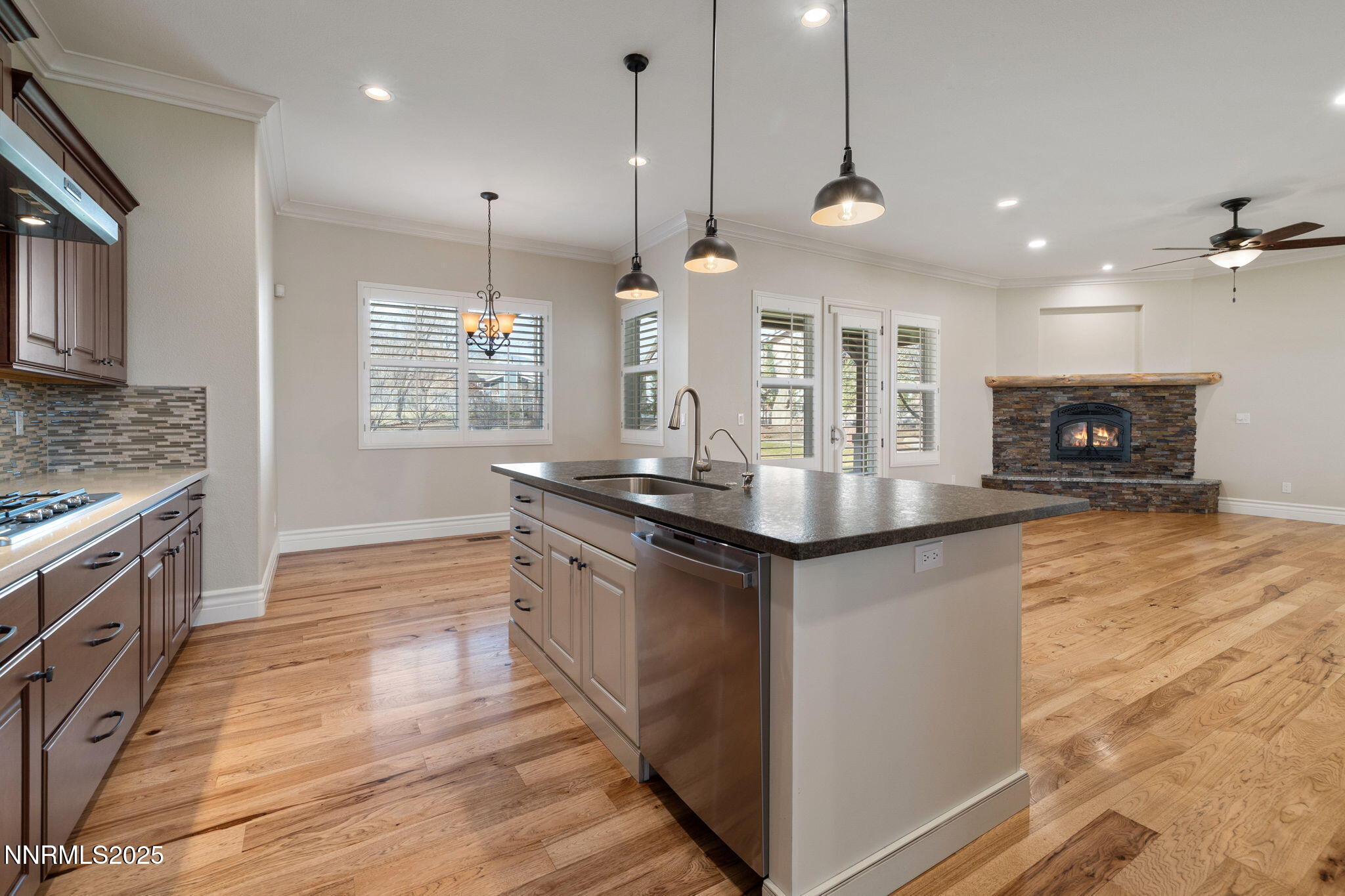 505 Sierra Manor Drive Reno, NV 89511 - Photo 8 of 36 a kitchen with stainless steel appliances granite countertop a sink a stove and a wooden floors