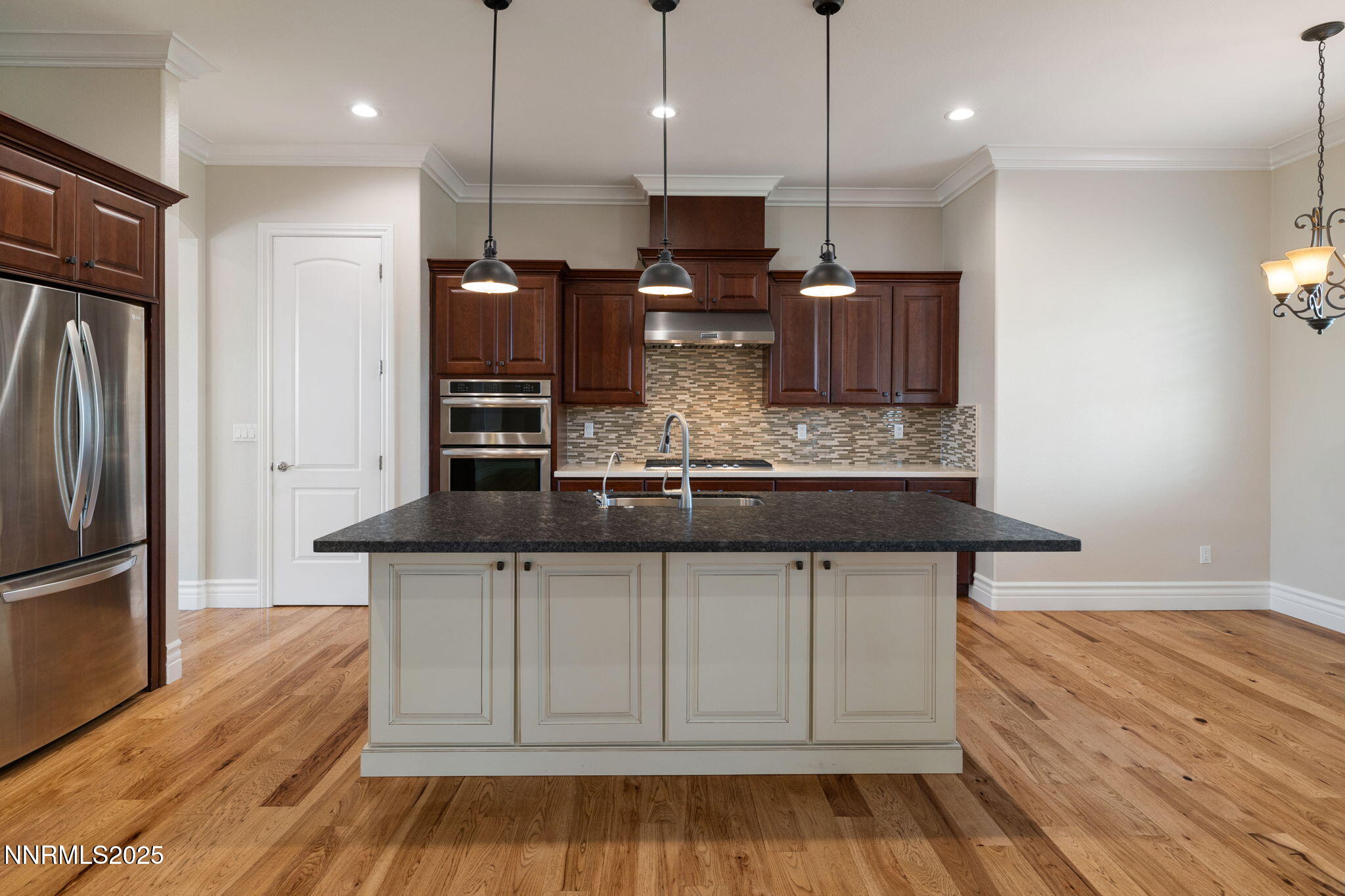 505 Sierra Manor Drive Reno, NV 89511 - Photo 10 of 36 a kitchen with stainless steel appliances granite countertop a sink a stove and a refrigerator