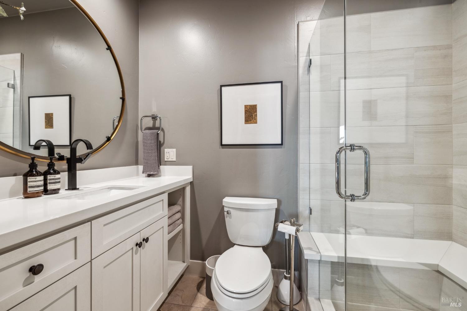 86 Fair Drive San Rafael, CA 94901 - Photo 20 of 65 a bathroom with a toilet sink vanity and mirror