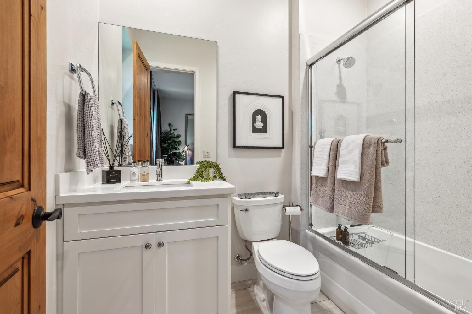 86 Fair Drive San Rafael, CA 94901 - Photo 40 of 65 a bathroom with a toilet a sink and mirror