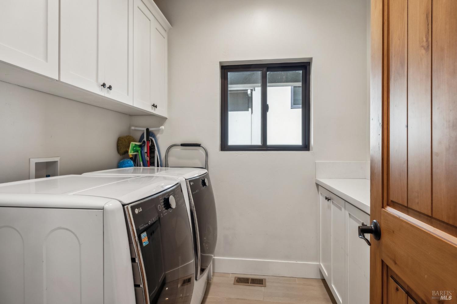 86 Fair Drive San Rafael, CA 94901 - Photo 63 of 65 a utility room with a sink a washer and dryer