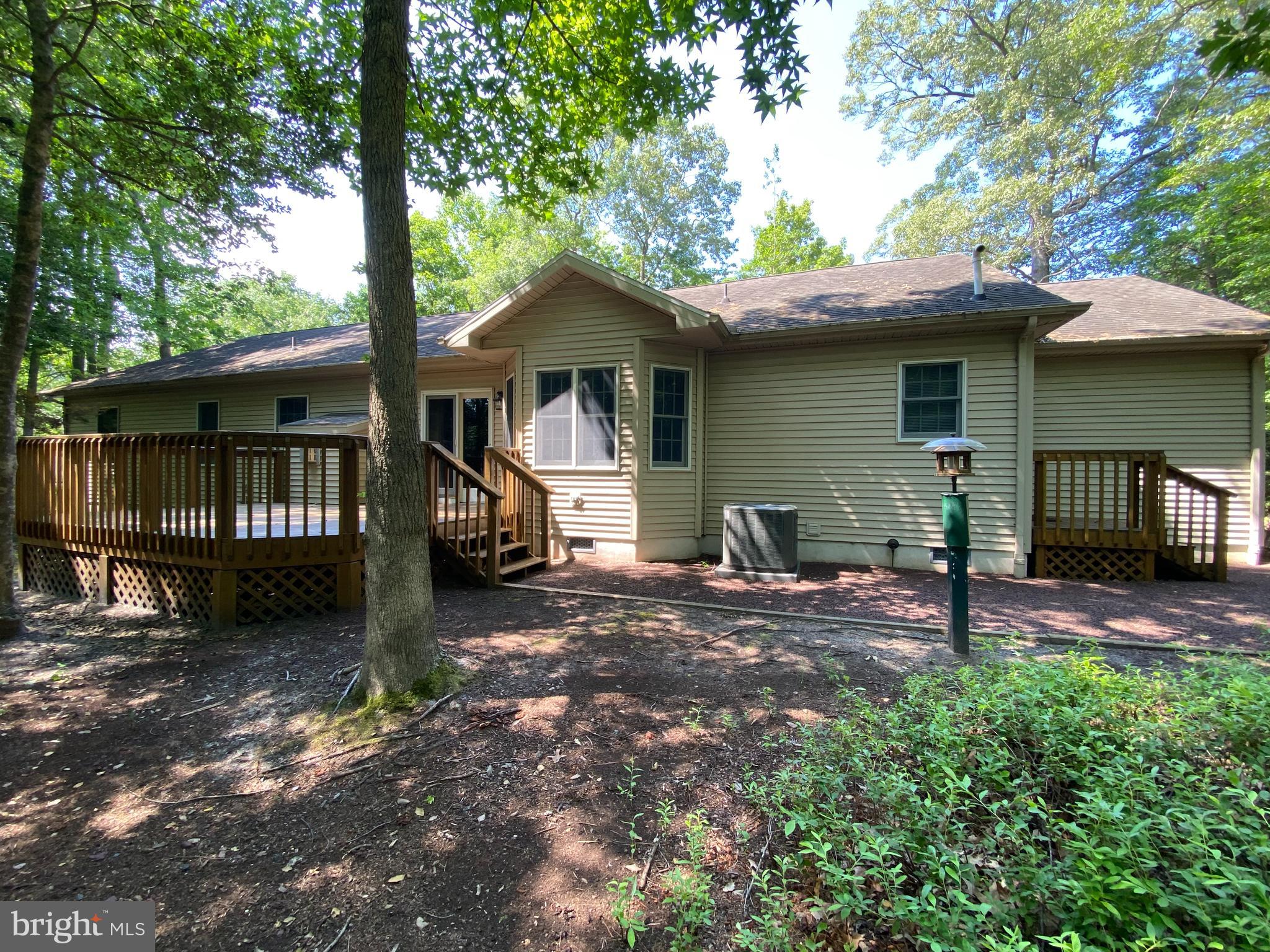 34404 Owls Nest Road Lewes, DE 19958 - Photo 1 of 63 Scenic backyard Back deck overlooking the woods