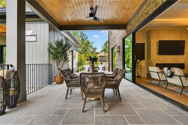 a view of a kitchen with cabinets and wooden floor