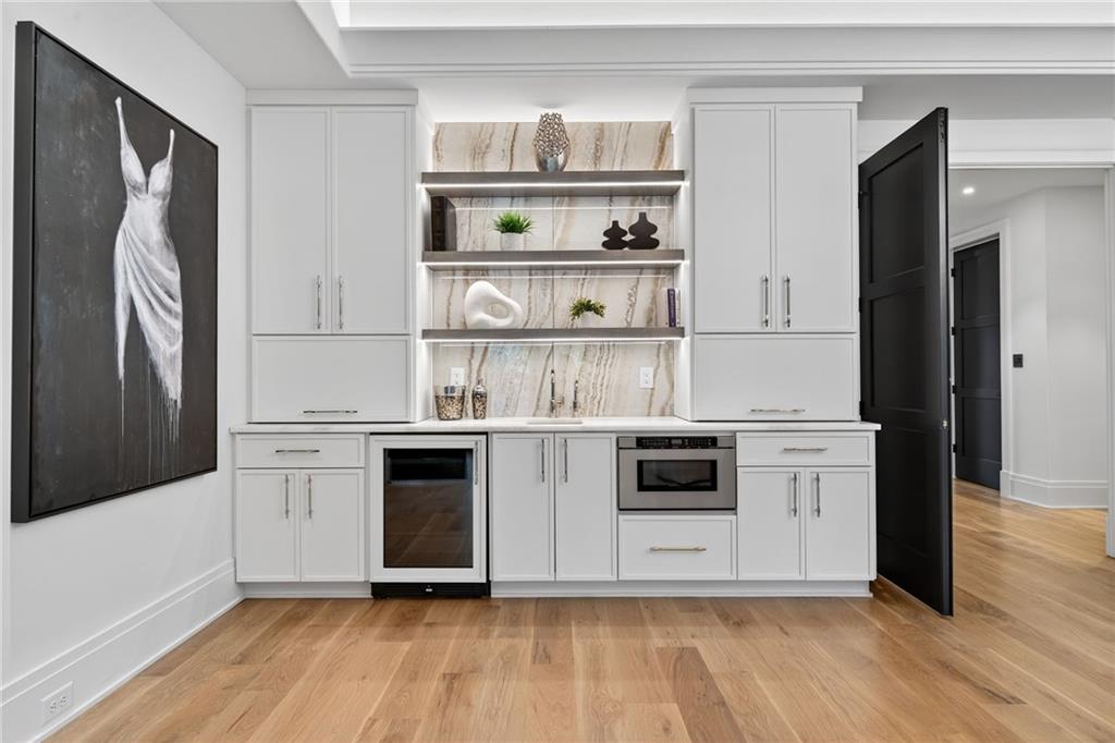 3565 Rivers Call Boulevard Atlanta, GA 30339 - Photo 23 of 78 a kitchen with stainless steel appliances a stove and white cabinets