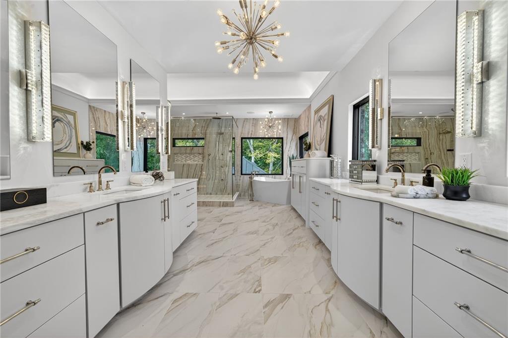 3565 Rivers Call Boulevard Atlanta, GA 30339 - Photo 26 of 78 a large white kitchen with a large window and stainless steel appliances