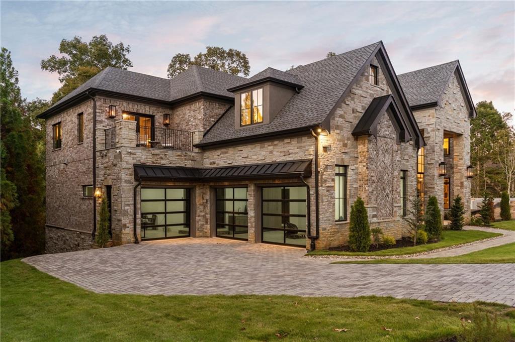 3565 Rivers Call Boulevard Atlanta, GA 30339 - Photo 3 of 78 a front view of a house with garden