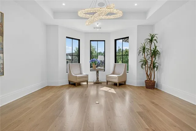 a bedroom with two beds and a large window