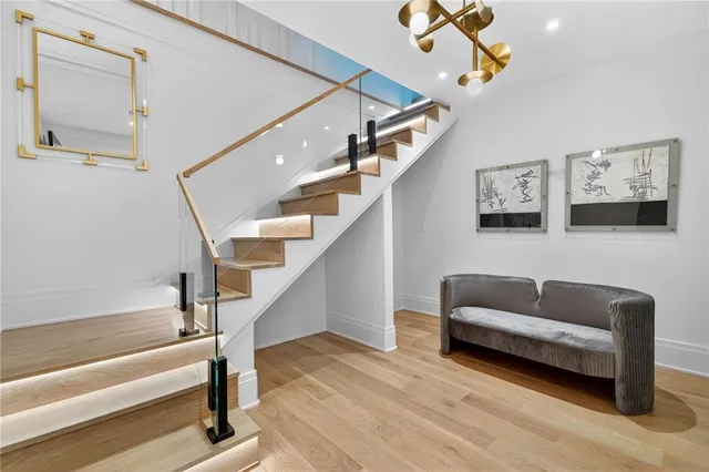 a bathroom with a granite countertop toilet sink and mirror