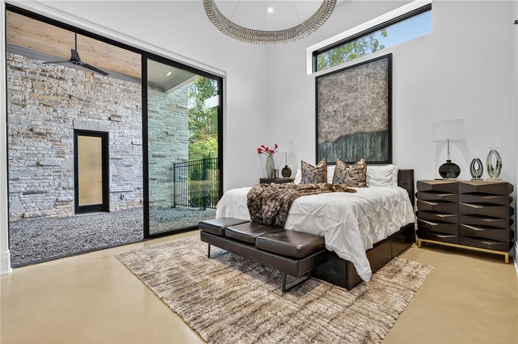 3565 Rivers Call Boulevard Atlanta, GA 30339 - Photo 36 of 78 a bed sitting in a spacious bedroom next to a window