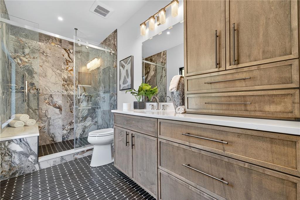 3565 Rivers Call Boulevard Atlanta, GA 30339 - Photo 40 of 78 a bathroom with a sink a toilet and shower
