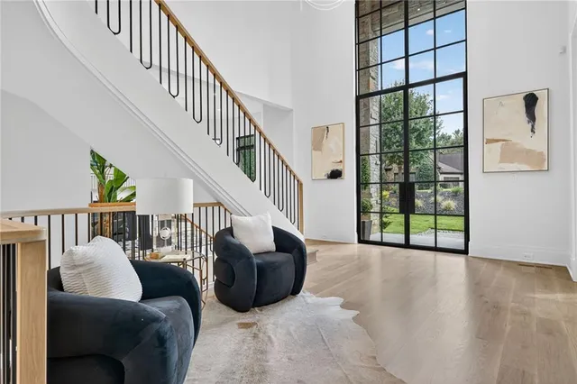 a living room with furniture and a chandelier
