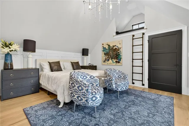 a view of a a dining room with furniture window and wooden floor