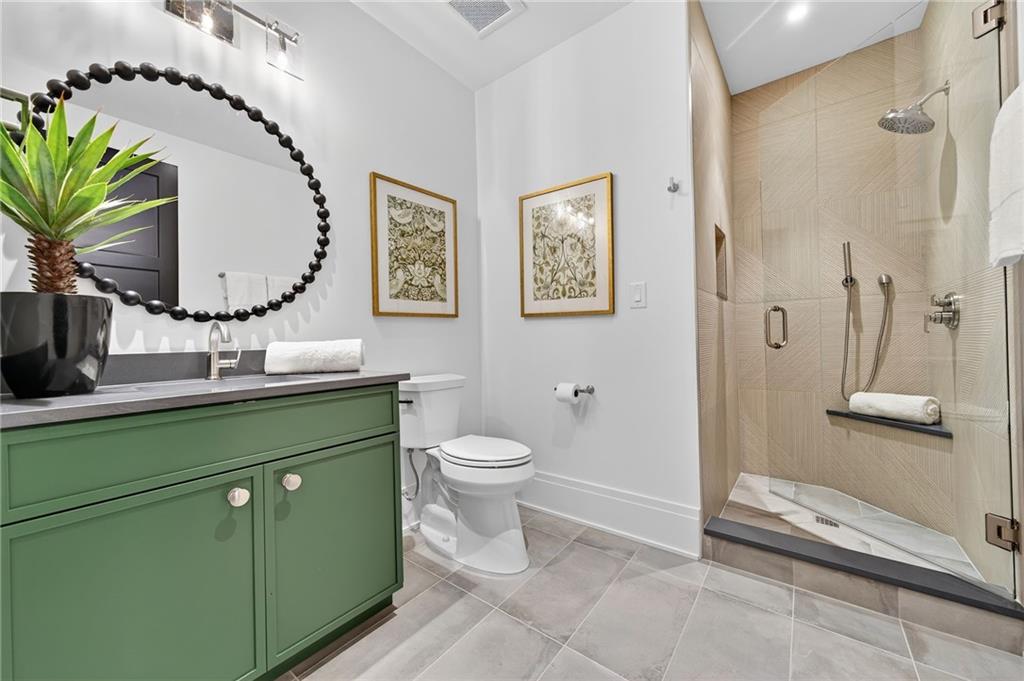 3565 Rivers Call Boulevard Atlanta, GA 30339 - Photo 47 of 78 a bathroom with a toilet sink and mirror