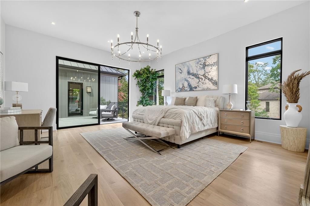 3565 Rivers Call Boulevard Atlanta, GA 30339 - Photo 48 of 78 a spacious bedroom with a bed and glass windows