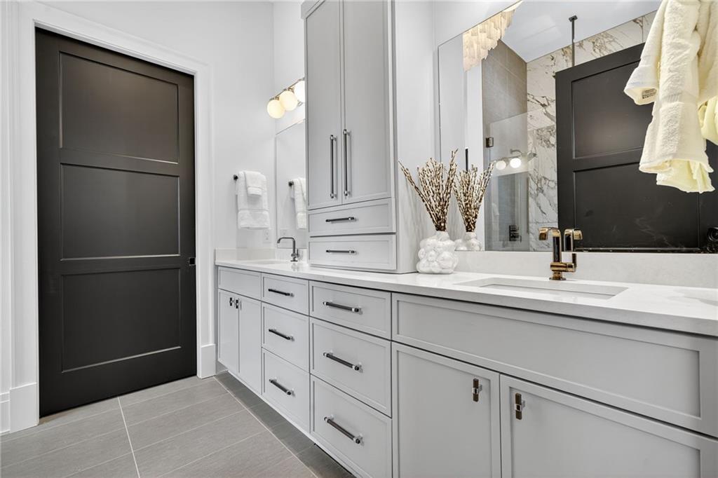 3565 Rivers Call Boulevard Atlanta, GA 30339 - Photo 49 of 78 a bathroom with a double vanity sink and a mirror