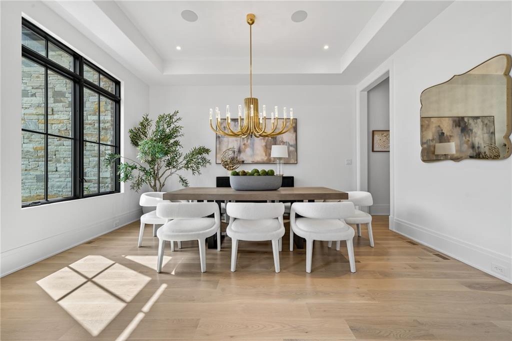 3565 Rivers Call Boulevard Atlanta, GA 30339 - Photo 5 of 78 a dining room with furniture a rug and wooden floor