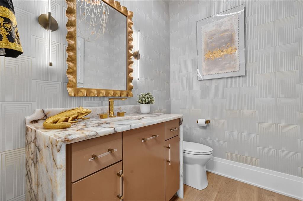 3565 Rivers Call Boulevard Atlanta, GA 30339 - Photo 51 of 78 a bathroom with a granite countertop toilet sink and mirror