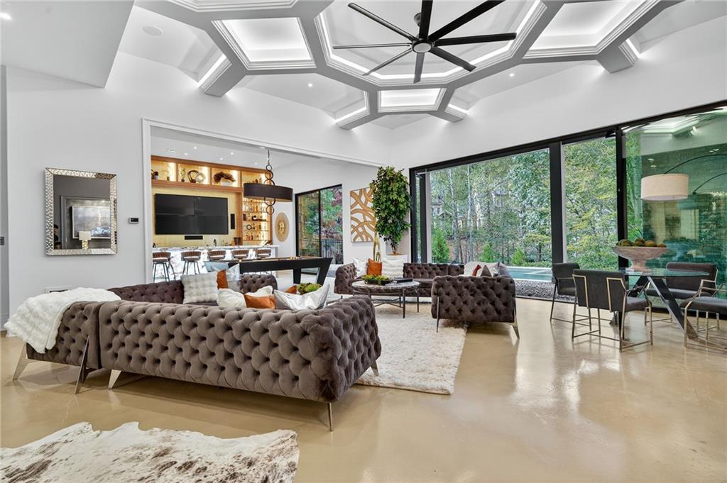 3565 Rivers Call Boulevard Atlanta, GA 30339 - Photo 58 of 78 a living room with furniture flat screen tv and a large window