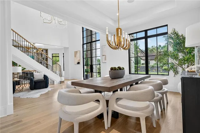 a view of a dining room with furniture window and wooden floor