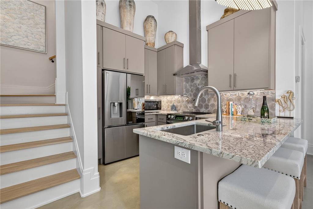 3565 Rivers Call Boulevard Atlanta, GA 30339 - Photo 67 of 78 a kitchen with stainless steel appliances granite countertop a sink stove and refrigerator