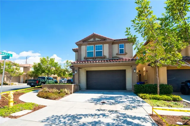 a view of a house with a yard and tree s